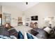 View of the open-concept living room showcases stylish decor, plush furniture, and a cozy atmosphere at 7574 Merrick Dr, Brownsburg, IN 46112