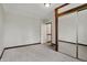 Inviting bedroom features carpet, natural light, and a closet with mirrored doors at 7609 Camby Rd, Indianapolis, IN 46113