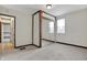 Cozy bedroom features plush carpet, natural light from window, and closet with mirrored doors at 7609 Camby Rd, Indianapolis, IN 46113
