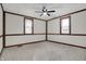 Bright bedroom with neutral color carpet, two windows and wood beam accents at 7609 Camby Rd, Indianapolis, IN 46113