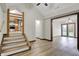 Inviting living room boasts light wood floors and easy access to the kitchen and outdoor patio at 7609 Camby Rd, Indianapolis, IN 46113