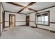 Cozy living room featuring a ceiling fan and natural wood trim at 7609 Camby Rd, Indianapolis, IN 46113