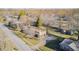 An elevated view of a home with mature trees and a green lawn, set in a peaceful neighborhood setting at 920 Mellowood Dr, Indianapolis, IN 46217