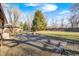 Large, grassy backyard with a concrete patio at 920 Mellowood Dr, Indianapolis, IN 46217