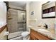 Bathroom featuring a tiled shower with glass door and a vanity with granite counters at 920 Mellowood Dr, Indianapolis, IN 46217