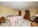 Comfortable bedroom features carpet, a decorative dresser, and complementary bedside furniture at 920 Mellowood Dr, Indianapolis, IN 46217
