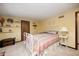 Bedroom featuring neutral walls and carpet with a vintage bed and a dresser at 920 Mellowood Dr, Indianapolis, IN 46217