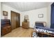 Comfortable bedroom with wood flooring, black bedding, and neutral walls at 920 Mellowood Dr, Indianapolis, IN 46217