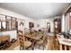 Dining room with hardwood floors, traditional wood table and chairs, and natural light at 920 Mellowood Dr, Indianapolis, IN 46217