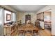 Dining room with hardwood floors, traditional wood table and chairs, and natural light at 920 Mellowood Dr, Indianapolis, IN 46217
