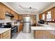 Functional kitchen with stainless steel appliances, ample cabinet space, and tile backsplash at 920 Mellowood Dr, Indianapolis, IN 46217