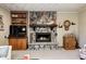 Living room with brick fireplace, built-in shelves, and a cozy atmosphere at 920 Mellowood Dr, Indianapolis, IN 46217