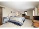 Spacious main bedroom with neutral carpet, a king-size bed, and ample natural light at 920 Mellowood Dr, Indianapolis, IN 46217