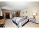Bright and airy main bedroom with wall to wall carpet and neutral colored walls at 920 Mellowood Dr, Indianapolis, IN 46217