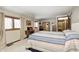 This main bedroom with neutral carpet and a sewing table has ample natural light at 920 Mellowood Dr, Indianapolis, IN 46217