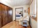 Sitting room with hardwood floors and a tan armchair is connected to a bedroom through an opening at 920 Mellowood Dr, Indianapolis, IN 46217