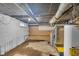 Unfinished basement with water heater and HVAC at 953 N Oakland Ave, Indianapolis, IN 46201