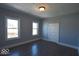 This bedroom features two windows providing lots of natural light and hardwood floors at 953 N Oakland Ave, Indianapolis, IN 46201