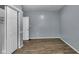 Neutral bedroom with hardwood floors and a spacious closet at 953 N Oakland Ave, Indianapolis, IN 46201