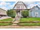 Charming two-story home with a landscaped front yard and inviting entrance at 953 N Oakland Ave, Indianapolis, IN 46201