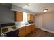 Cozy kitchen features wood cabinets, white countertops, and modern appliances at 953 N Oakland Ave, Indianapolis, IN 46201