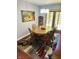 Warm dining room featuring wood table, six chairs, and elegant rug at 1030 Pamela Dr, Plainfield, IN 46168