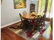 Warm dining room featuring wood table, six chairs, and elegant rug at 1030 Pamela Dr, Plainfield, IN 46168