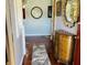 Inviting entryway featuring hardwood floors, decorative furnishings, and artistic accents at 1030 Pamela Dr, Plainfield, IN 46168