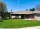 Well-maintained brick home with a lush green lawn and manicured landscaping at 1030 Pamela Dr, Plainfield, IN 46168