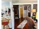 Hallway featuring hardwood floors, neutral wall colors, and decorative wall accents at 1030 Pamela Dr, Plainfield, IN 46168