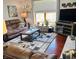 Cozy living room with large window, plush sofa, and decorative accents at 1030 Pamela Dr, Plainfield, IN 46168