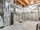Unfinished basement with exposed pipes and walls at 10603 Hinterland Dr, Fishers, IN 46038