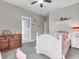 Neutral bedroom with carpet, ceiling fan and white decorative furnishings at 10603 Hinterland Dr, Fishers, IN 46038