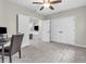 Bright bedroom boasts soft carpet, a ceiling fan, and double door closet space at 10603 Hinterland Dr, Fishers, IN 46038