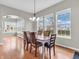 Bright dining room with large windows, hardwood floors, and a stylish chandelier at 10603 Hinterland Dr, Fishers, IN 46038