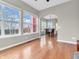 Spacious living room with hardwood floors and abundant natural light from large windows at 10603 Hinterland Dr, Fishers, IN 46038