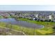 Aerial view of the golf course, pond and lovely suburban neighborhood at 11050 Midnight Pass, Fishers, IN 46037