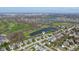 Wide aerial view of home, golf course and pond in a well-established neighborhood at 11050 Midnight Pass, Fishers, IN 46037