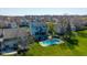 Beautiful backyard with a sparkling pool, lush green lawn, and solar panels on the roof at 11050 Midnight Pass, Fishers, IN 46037