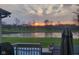 Stunning backyard view with sunset over the pond and golf course, seen from back deck at 11050 Midnight Pass, Fishers, IN 46037
