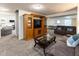 Spacious finished basement features a large entertainment center, comfortable seating, and neutral carpeting at 11050 Midnight Pass, Fishers, IN 46037