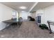 Finished basement with ping pong table and ample entertainment space at 11050 Midnight Pass, Fishers, IN 46037