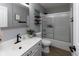 Bathroom featuring modern vanity and shower with glass doors at 11050 Midnight Pass, Fishers, IN 46037