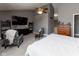 A spacious main bedroom with vaulted ceiling, sitting area, ceiling fan and dresser at 11050 Midnight Pass, Fishers, IN 46037