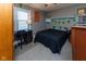 Bedroom with neutral walls, ceiling fan, and large window at 11050 Midnight Pass, Fishers, IN 46037