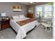 Bedroom with neutral walls, ceiling fan, and large window at 11050 Midnight Pass, Fishers, IN 46037