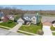 Charming two-story brick home featuring a well-manicured lawn at 11050 Midnight Pass, Fishers, IN 46037