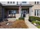 Inviting front porch with a swing and American flag, creating a warm and welcoming entrance at 11050 Midnight Pass, Fishers, IN 46037