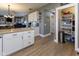 A well-designed kitchen with granite countertops, white cabinets, and an organized pantry at 11050 Midnight Pass, Fishers, IN 46037