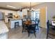 A well-appointed kitchen and dining area featuring granite countertops and stainless steel appliances at 11050 Midnight Pass, Fishers, IN 46037